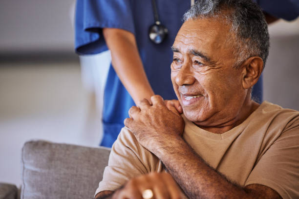 Caring nurse comforting a senior man