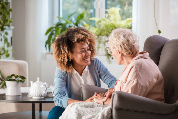 Caregiver sharing a warm moment with a senior woman